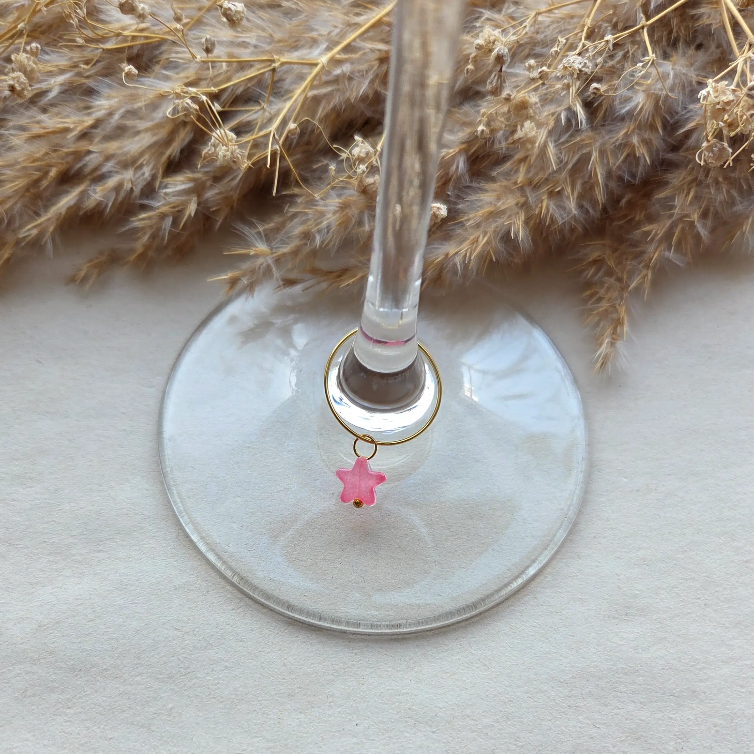 Star glasmarkers in het goud